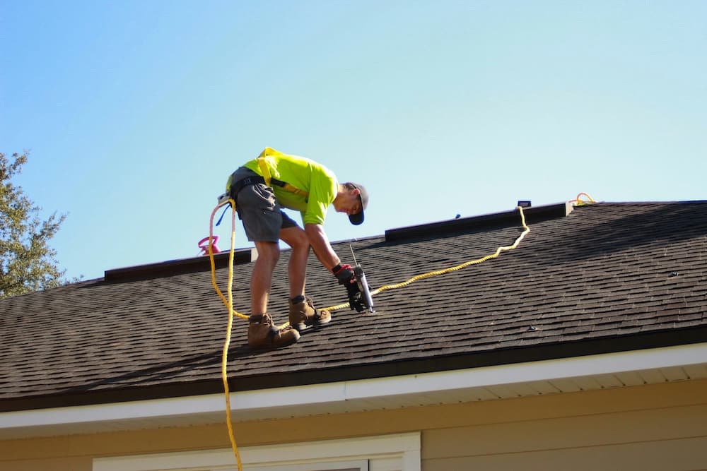 Roofer working on Australian building - Roofing trade opportunities
